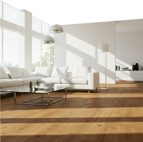 Bright living room with white sofa, large windows, and wooden floor.